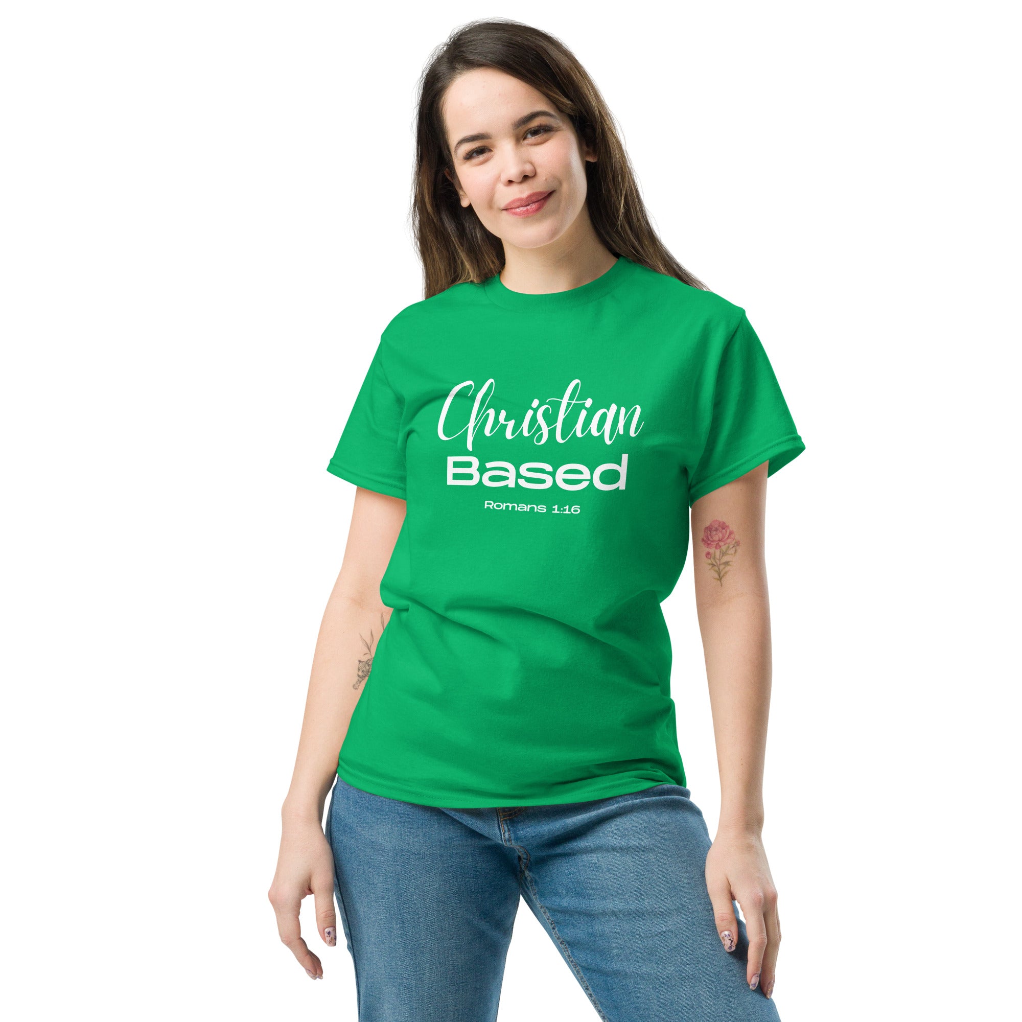 Female model wearing an Irish green women’s Christian t-shirt front view with the text Christian Based and Romans 1:16 in feminine handwritten and bold block fonts