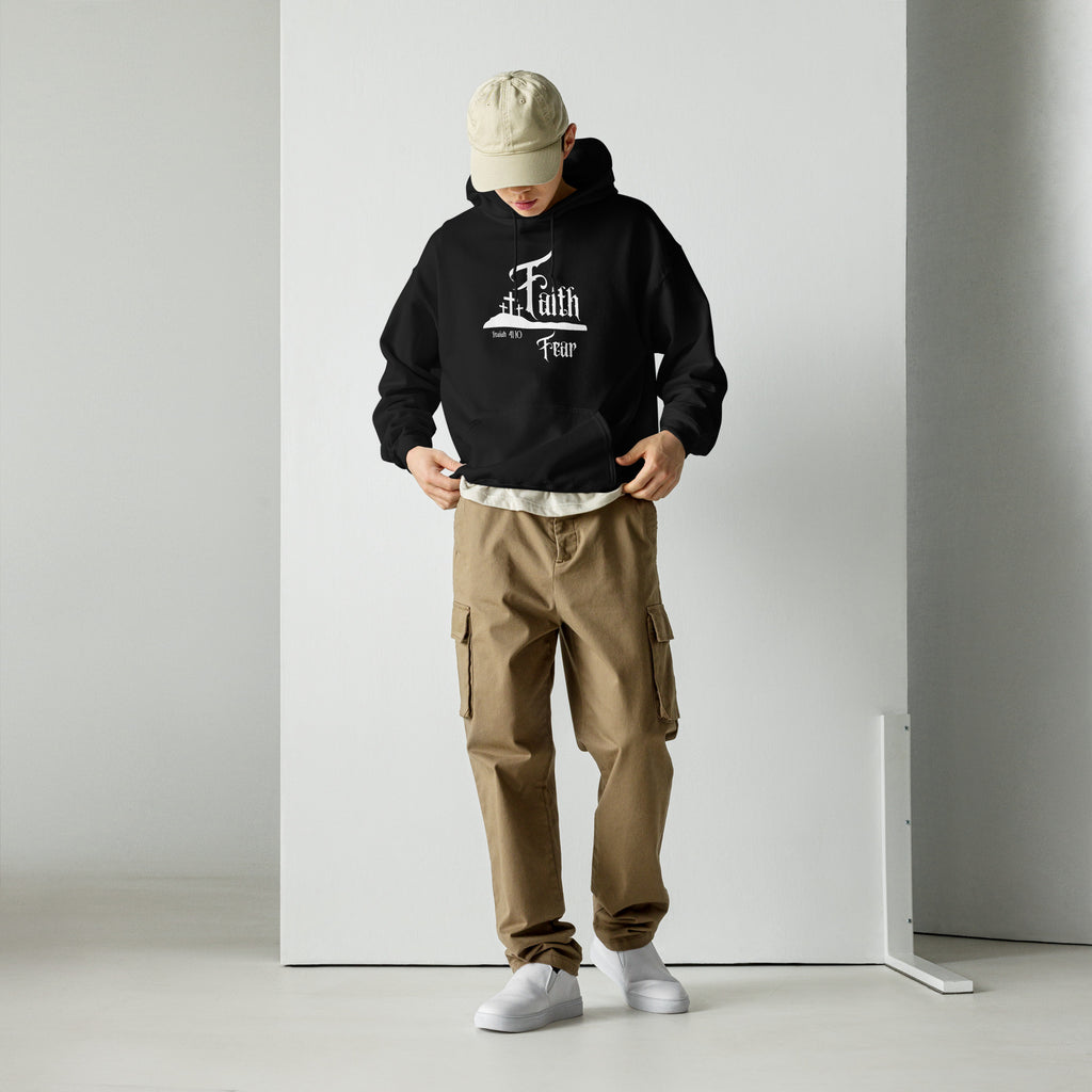 Male model wearing the Faith Over Fear men’s Christian hoodie in black, full body front view showing the Faith over Fear design with a three crosses hill