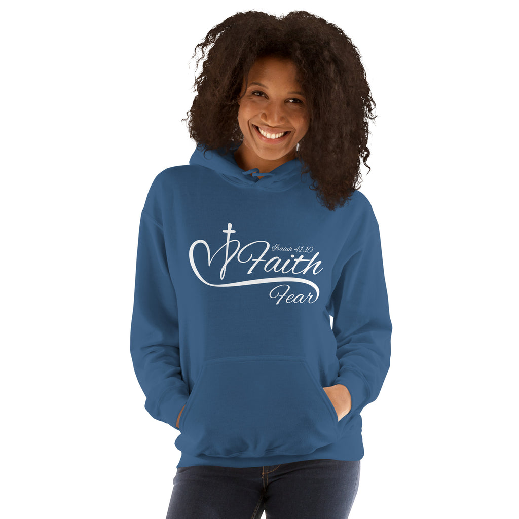 Female model wearing an indigo blue Faith Over Fear women’s Christian hoodie with layered Faith and Fear typography and a heart and cross design between the words, inspired by Isaiah 41:10