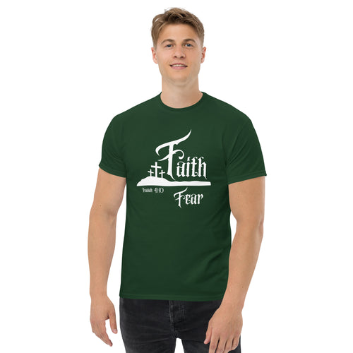 Male model wearing the Faith Over Fear men’s Christian t-shirt in forest green showing the full front design with “Faith” above “Fear” separated by three crosses on a hill