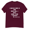 Flat lay front view of men’s Christian t-shirt in maroon featuring the text “I gave her a rib and all I got was this t-shirt” with “Genesis 2:22” in white font alongside a heart and cross graphic.