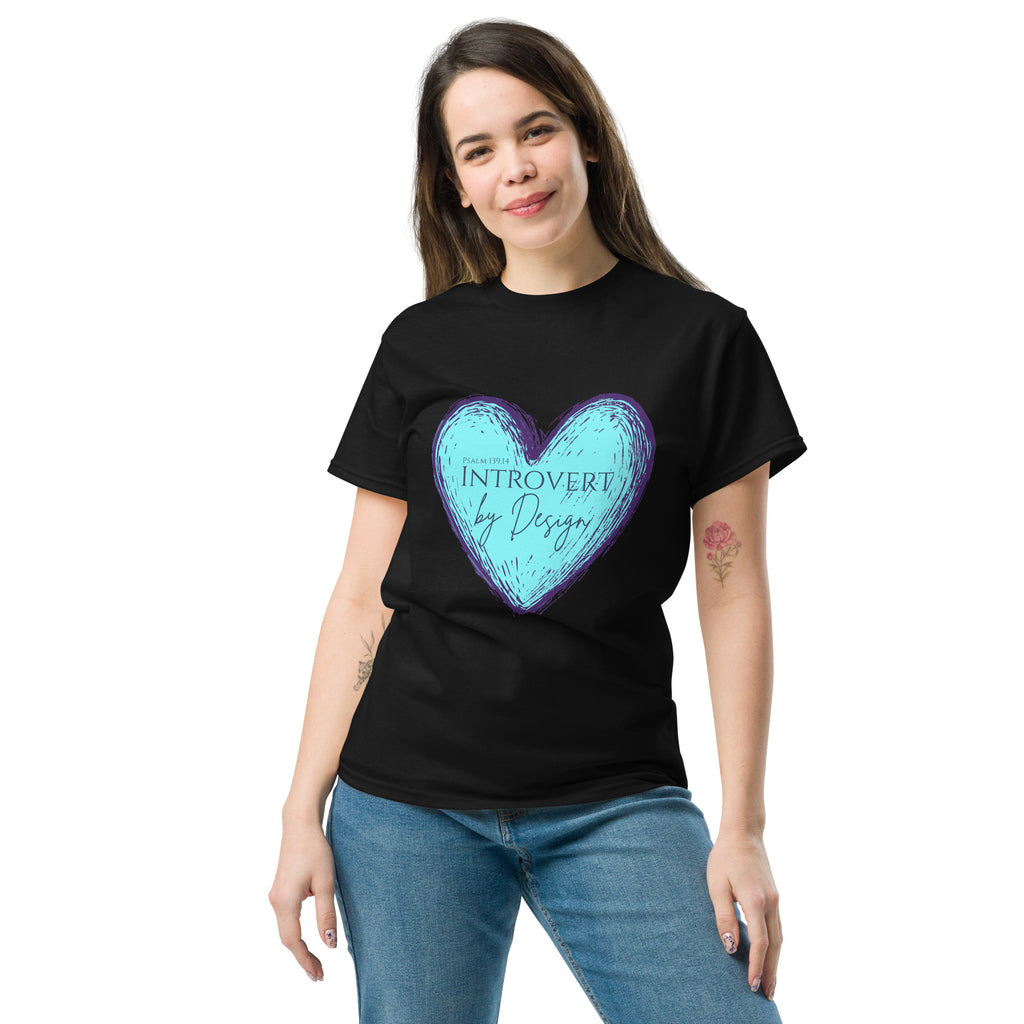 Female model wearing black women’s Christian t-shirt featuring a sketched light blue heart with purple outline and the text “PSALM 139:14 INTROVERT by Design” in purple font on the front.