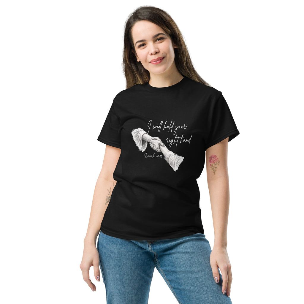 Front view of female model wearing the women’s Christian t-shirt in black showing script text reading I will hold your right hand with Isaiah 41:13 and illustration of Jesus holding a woman’s right hand