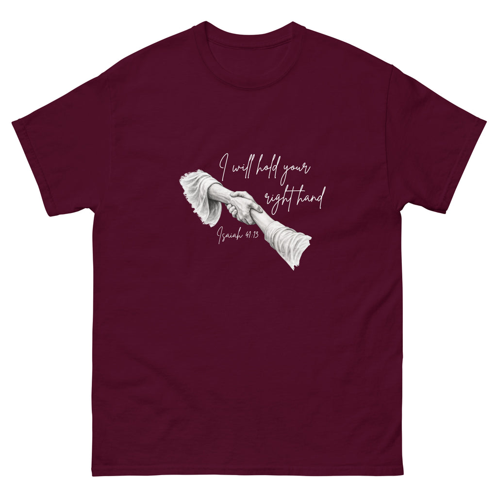 Flat lay front view of women’s Christian t-shirt in maroon featuring script text reading I will hold your right hand with Isaiah 41:13 and illustration of Jesus holding a woman’s right hand