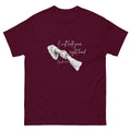 Flat lay front view of women’s Christian t-shirt in maroon featuring script text reading I will hold your right hand with Isaiah 41:13 and illustration of Jesus holding a woman’s right hand