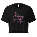Flat lay of women’s Christian crop top in black featuring the text Jesus Is My Valentine with the T designed as a cross wrapped in a rose