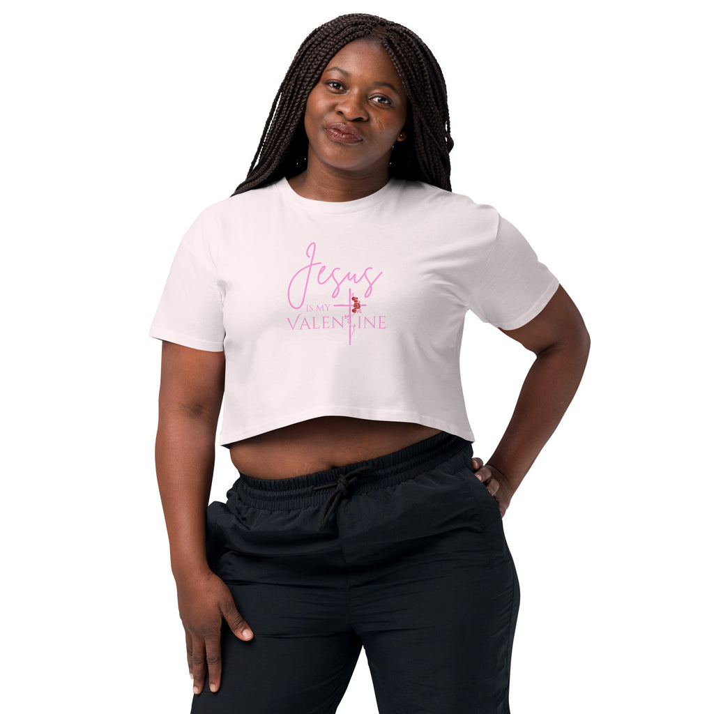 Close-up of a woman wearing the orchid Jesus Is My Valentine Christian crop top showing the cross and rose detail