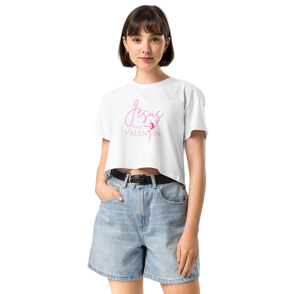 Front view of a woman wearing the white Jesus Is My Valentine Christian crop top showing the cross and rose detail