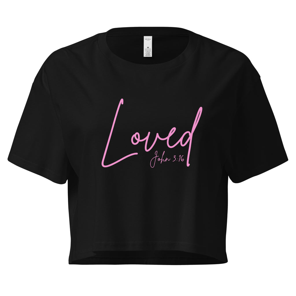 Lay flat front view of women’s cropped Christian top in black featuring the word Loved in pink script with John 3:16