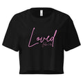Lay flat front view of women’s cropped Christian top in black featuring the word Loved in pink script with John 3:16