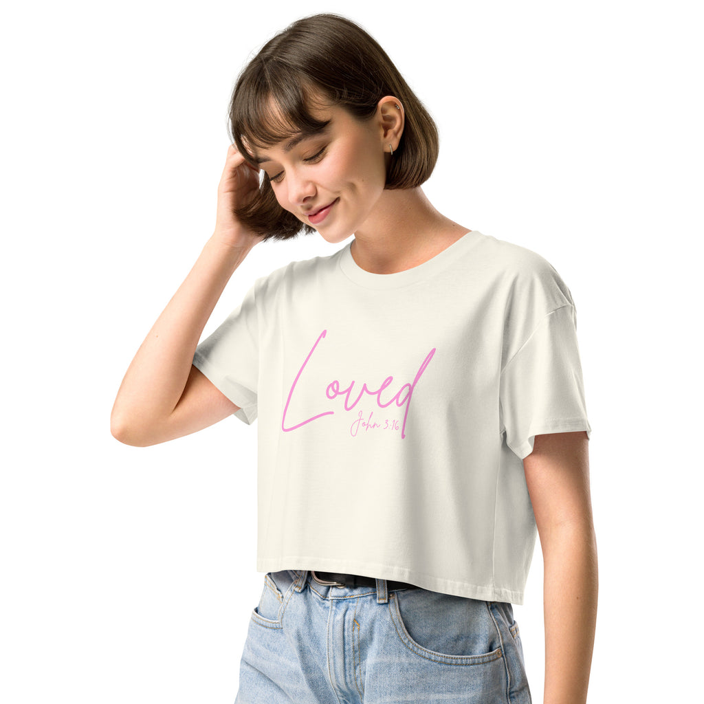 Close-up female model wearing the women’s cropped Christian top in natural showing the word Loved and John 3:16