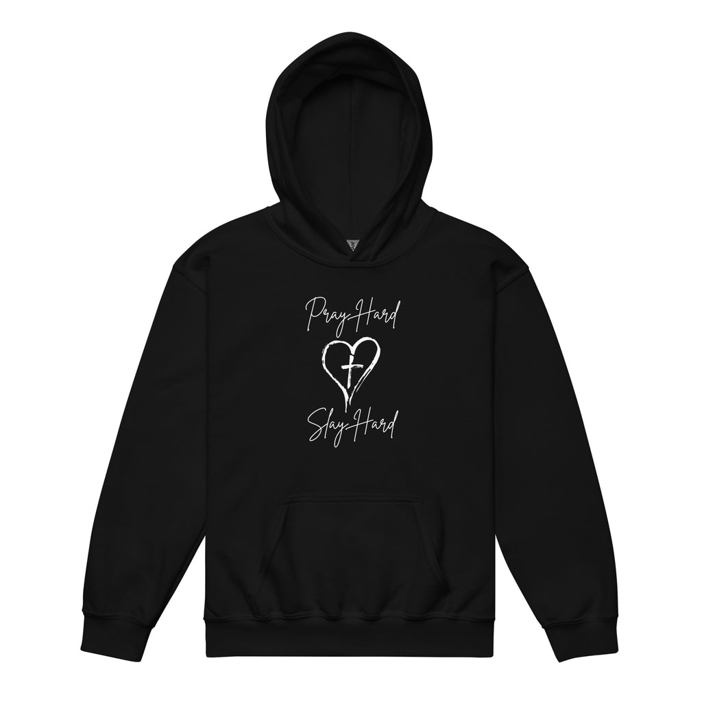 Flat lay front view of a girls Christian hoodie in black featuring the exact text “Pray Hard” and “Slay Hard” in script font with a heart and a cross in the center between the phrases