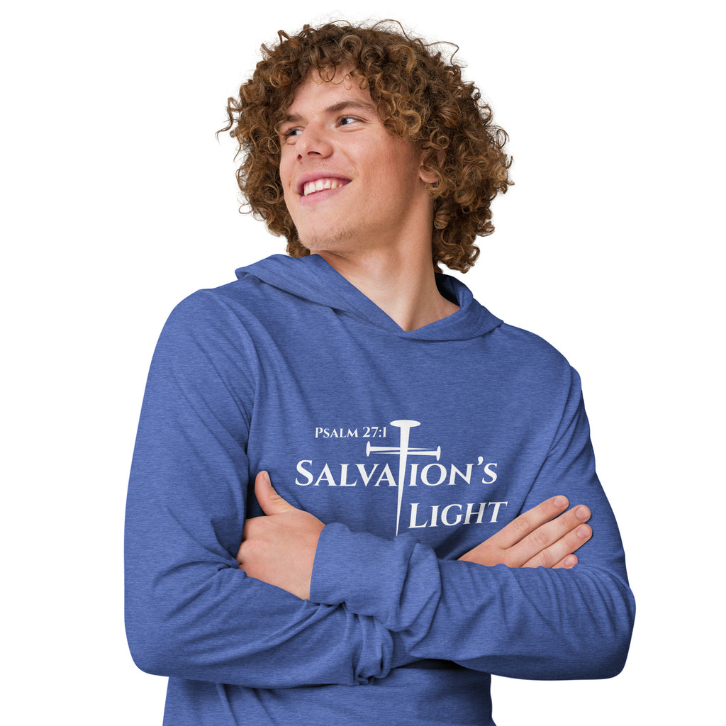 Close-up front view of a male model wearing the heather true royal men’s Christian hooded long sleeve tee displaying the Salvation’s Light design with “Salvation’s Light,” the cross formed by three nails as the “T,” and the Scripture reference “Psalm 27:1.”