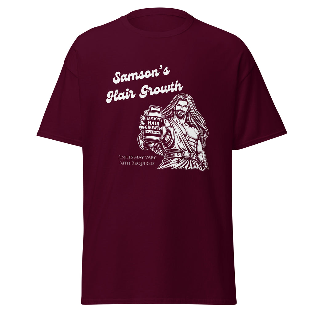 Flat lay front view of maroon men’s Christian humor t-shirt displaying an image of Samson holding a bottle labeled “Samson’s Hair Growth for Men” with the text “Samson’s Hair Growth” and fine print that reads “Results may vary. Faith Required.”