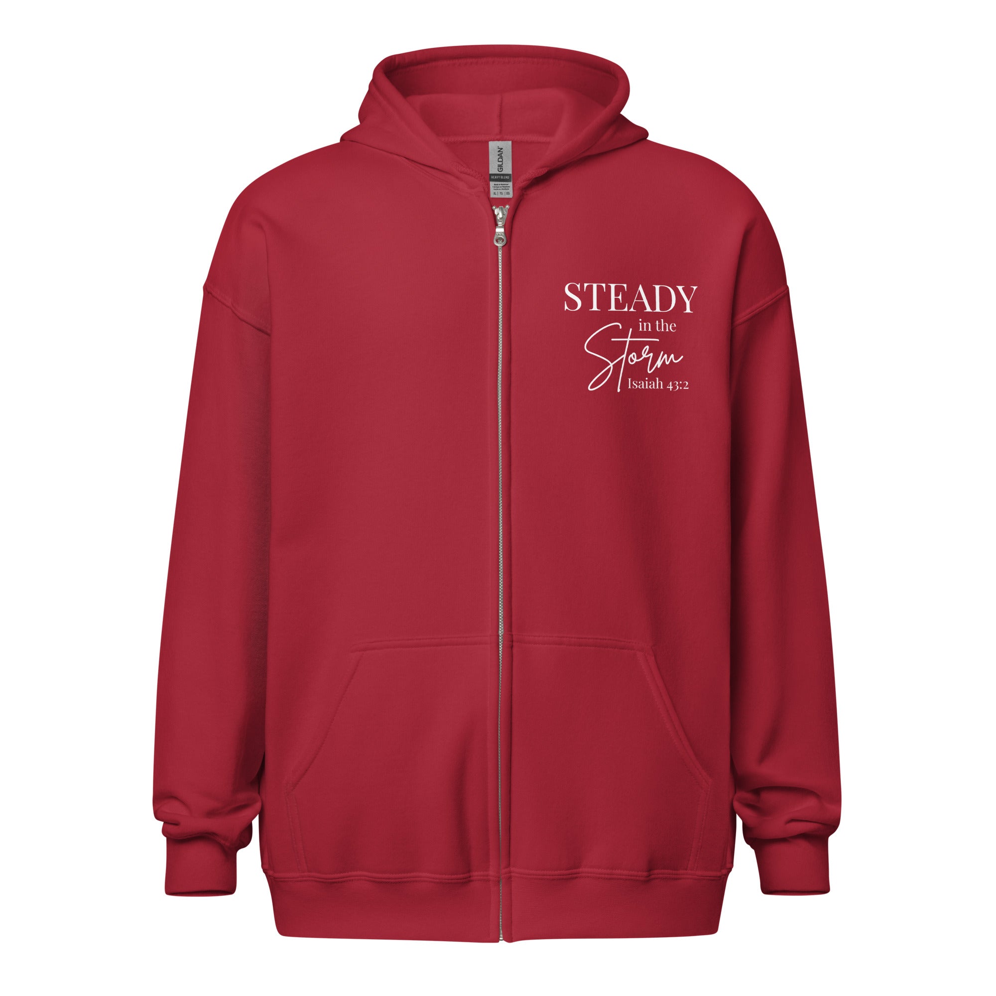 Cardinal red women’s zip hoodie with small left chest Christian design reading “STEADY in the Storm Isaiah 43:2” with Storm in handwritten script and STEADY in bold block lettering.