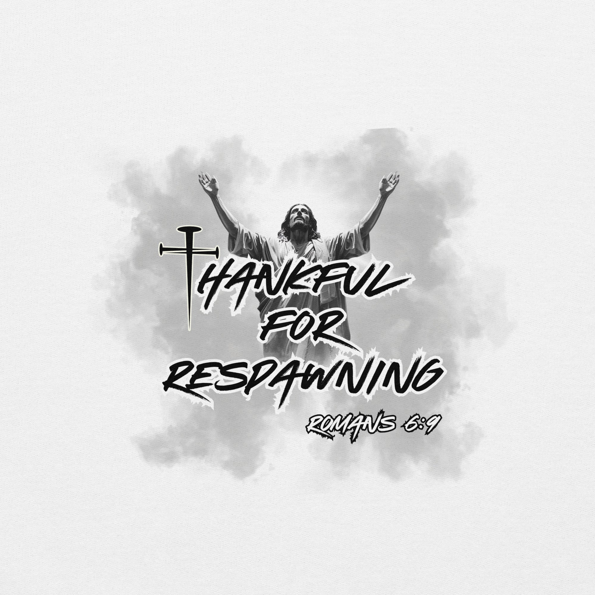 Close-up detail of the white men’s Christian hoodie showing the full design text “Thankful for Respawning” and “Romans 6:9,” the “t” in Thankful formed by three nails, and Jesus looking to Heaven with His arms raised with radiant light and clouds behind Him.