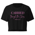 Black women’s crop t-shirt lay flat front featuring the left chest text “CARRIED through the Chaos Psalm 55:22.” “Through the Chaos” appears in a handwritten font.