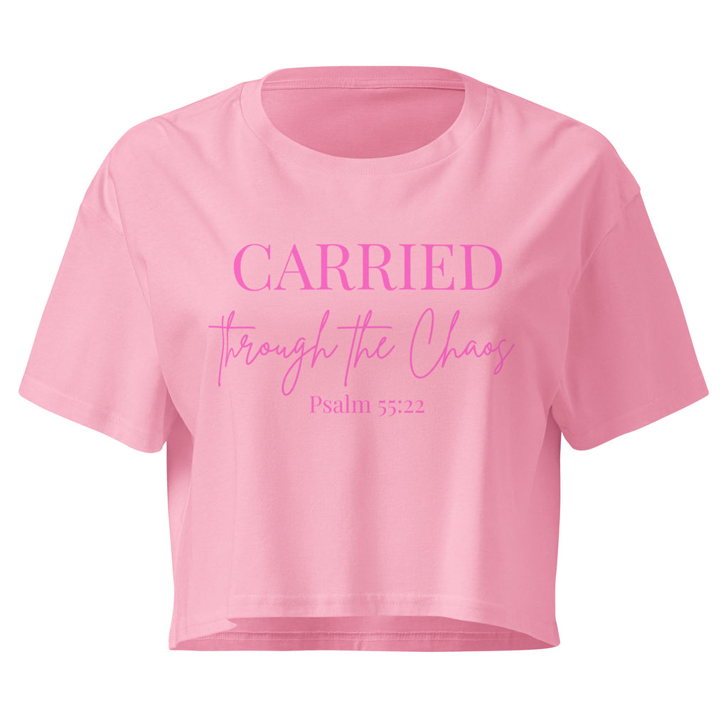 Bubblegum pink women’s crop t-shirt lay flat front featuring the left chest text “CARRIED through the Chaos Psalm 55:22.” “Through the Chaos” appears in a handwritten font.